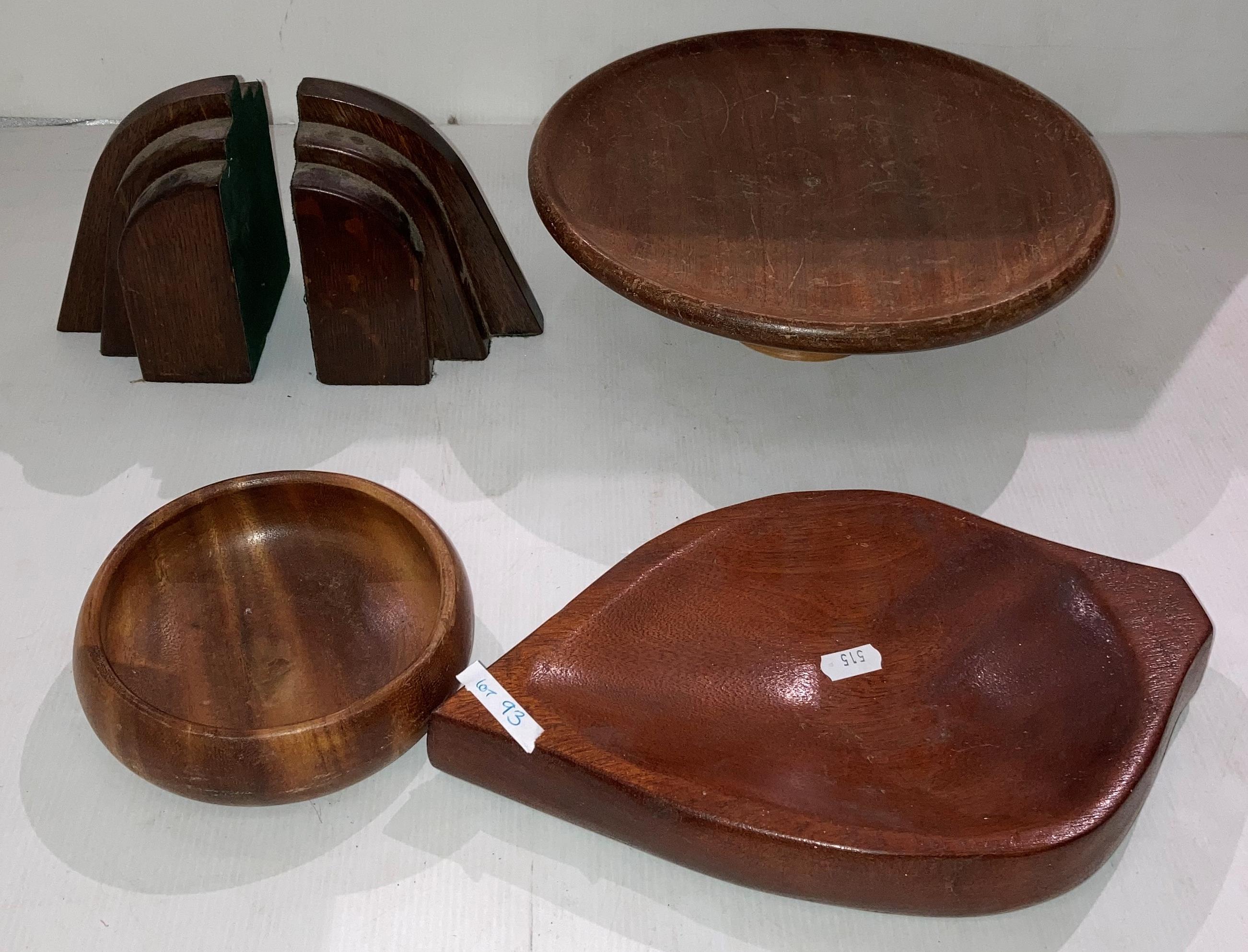 Pair of oak Art Deco-style book ends and three wooden display bowls and plates (saleroom location:
