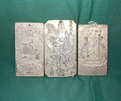 Three Oriental silver coloured metal zodiac plaques (not tested), each plaque approximately 9.