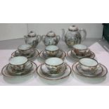 A vintage 21-piece Japanese Kutani-ware tea service with hand-painted Geisha scene - set includes 6