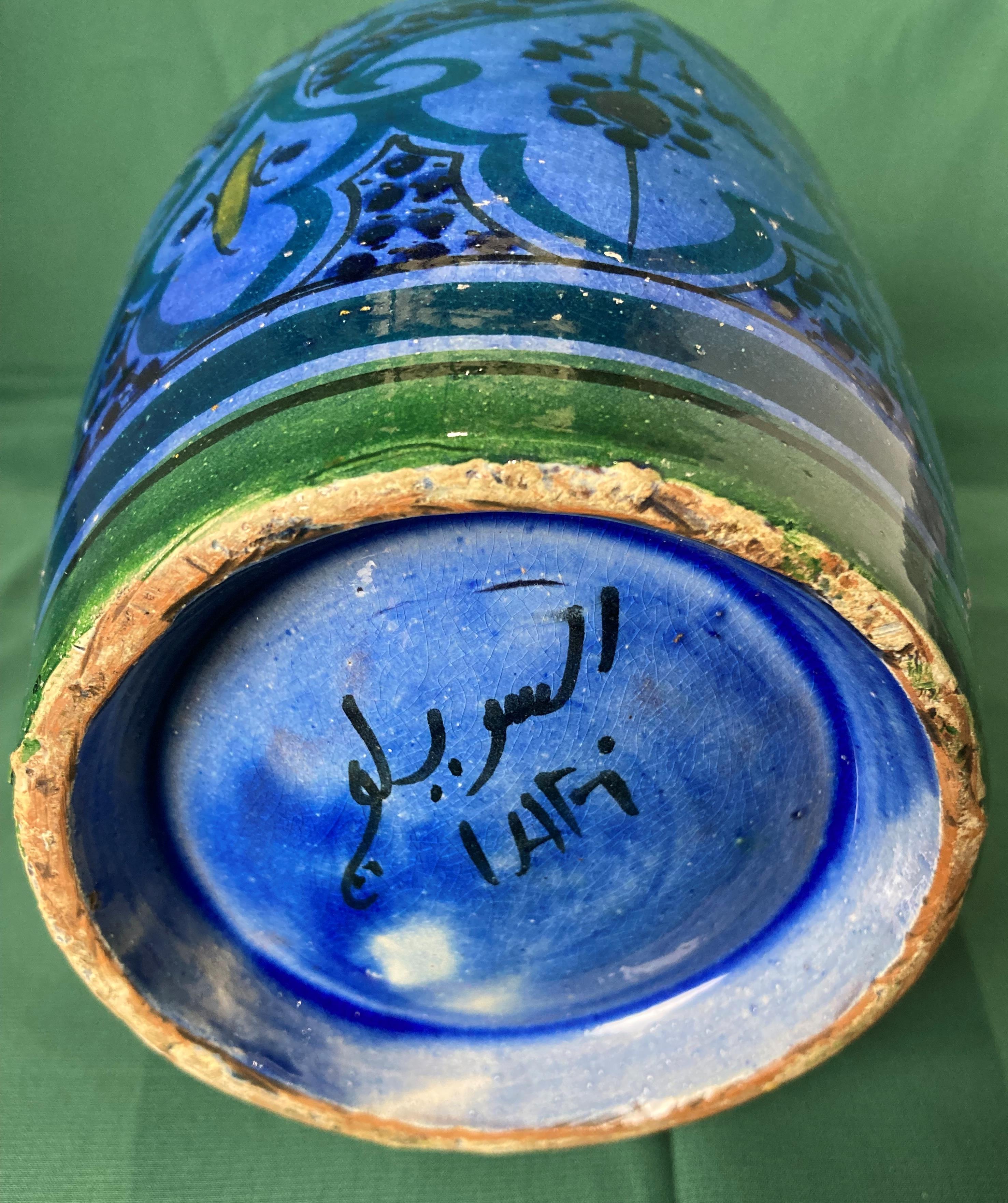 A clay glazed blue and black Persian vase (25cm high) with markers mark to base (saleroom location: - Image 3 of 4