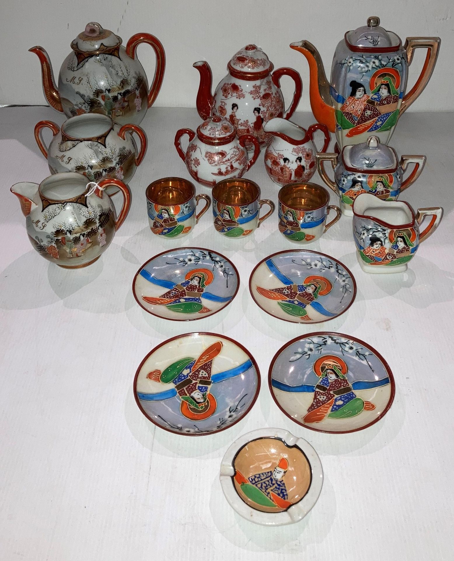 A hand-painted vintage Japanese Samurai 10-piece tea service with Geishas and gilt to inside of