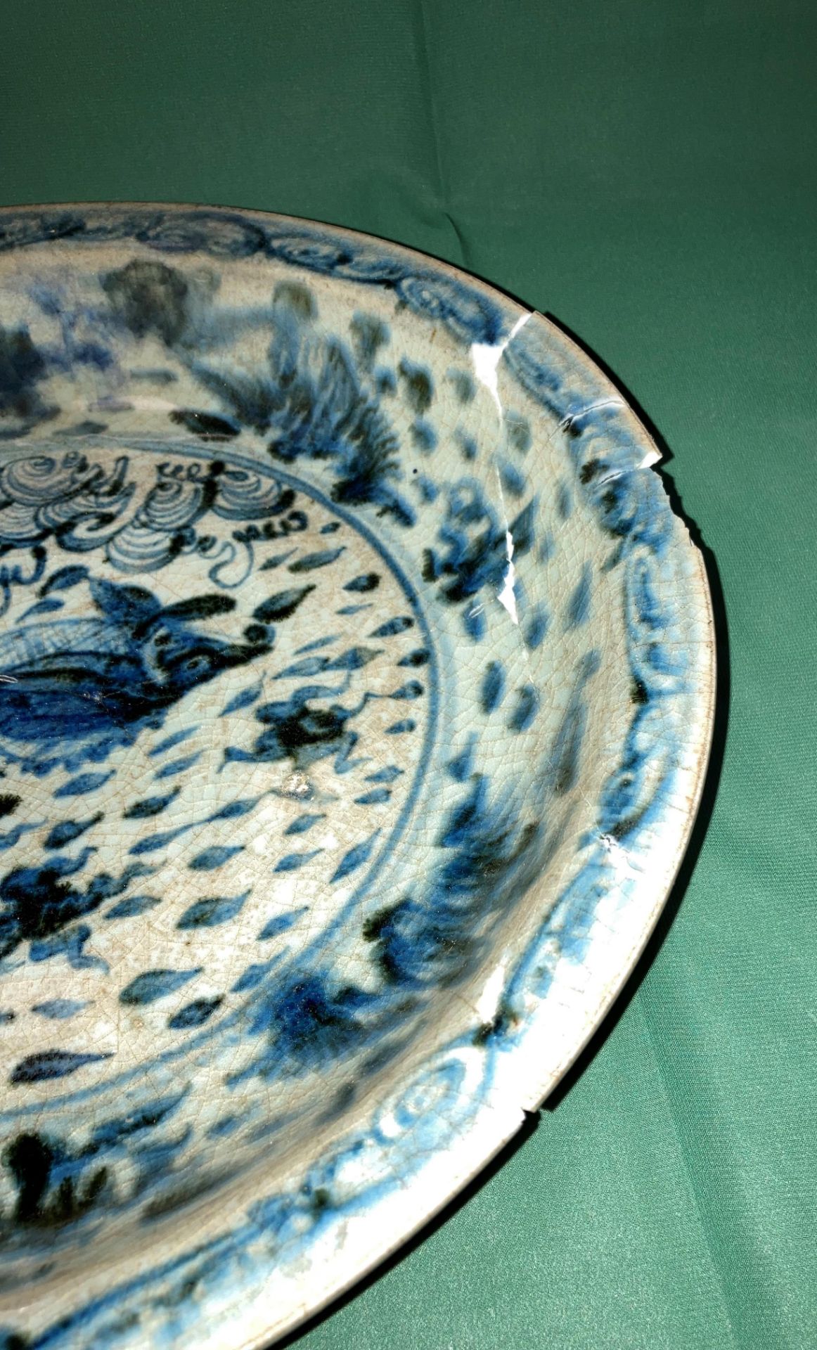 An antique Oriental blue and white glazed bowl with fish in pond to centre (bowl damaged and been - Image 3 of 6
