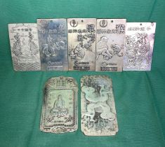 Seven assorted Oriental zodiac plaques in silver metal (not tested),