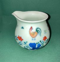 An Oriental hand-painted milk/cream jug possibly Jingdezhen with six symbol makers mark to base in