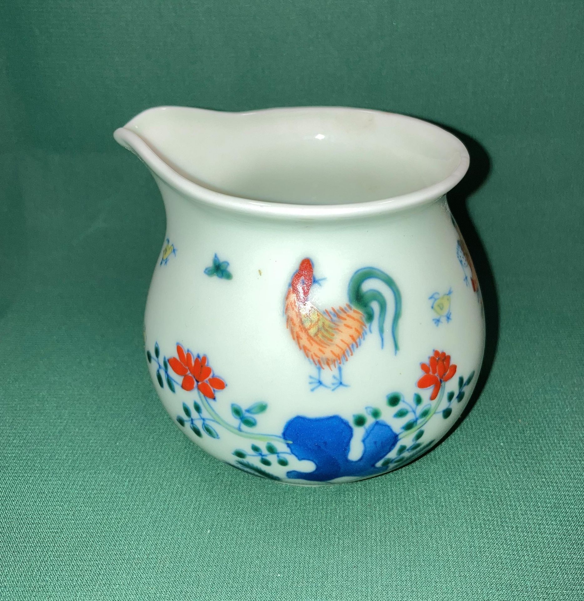 An Oriental hand-painted milk/cream jug possibly Jingdezhen with six symbol makers mark to base in