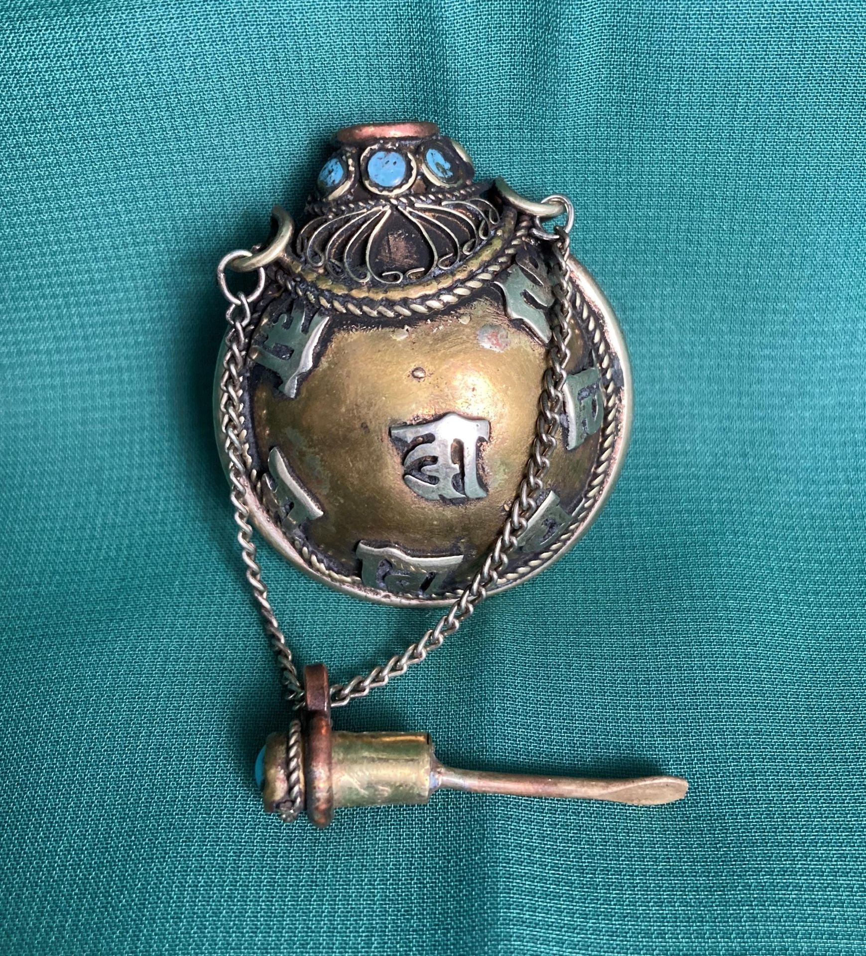 An antique Chinese/Tibetan hand-made metal snuff/opium bottle with light blue stones, - Image 3 of 4