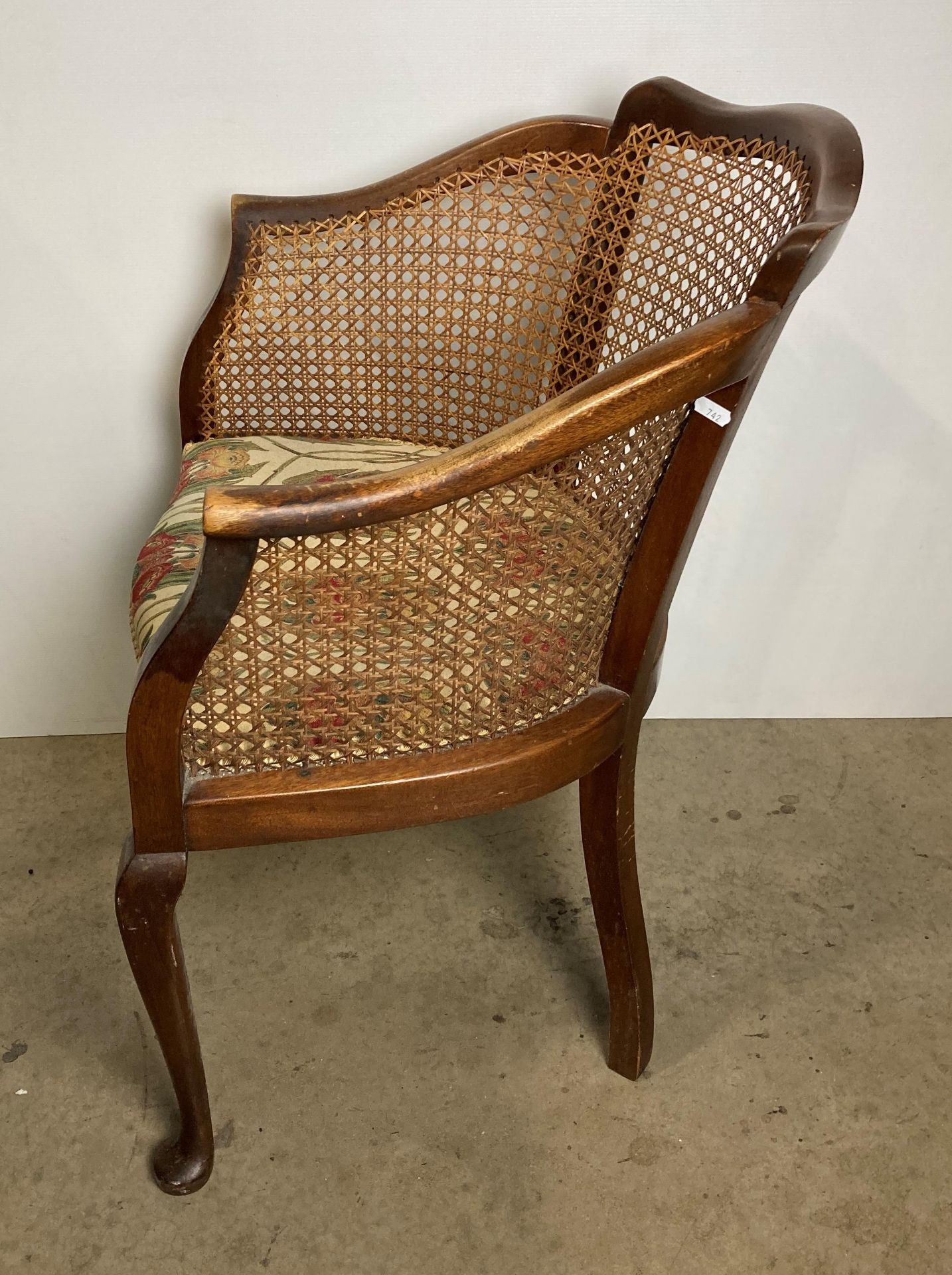 A vintage Bergère armchair with floral upholstered seat fabric (saleroom location: S2 QB13) - Image 3 of 5