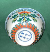 An antique Chinese Doucai hand-painted bowl with foliage design and markers mark to base - Qing