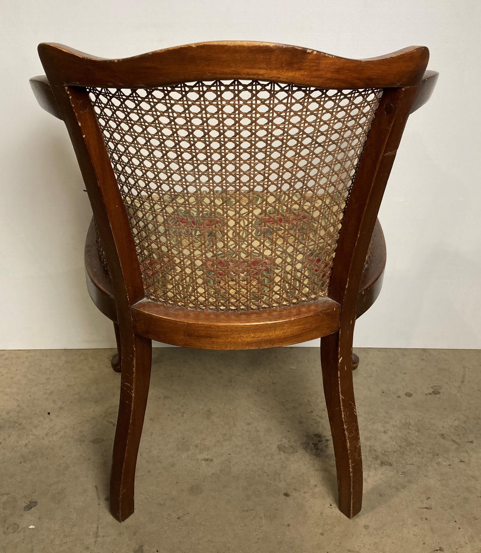 A vintage Bergère armchair with floral upholstered seat fabric (saleroom location: S2 QB13) - Image 4 of 5