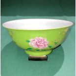 An Oriental hand-painted Famille-Rose bowl with floral design,