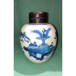 An antique Oriental blue and white ginger jar with engraved wooden lid,