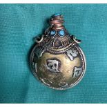 An antique Chinese/Tibetan hand-made metal snuff/opium bottle with light blue stones,