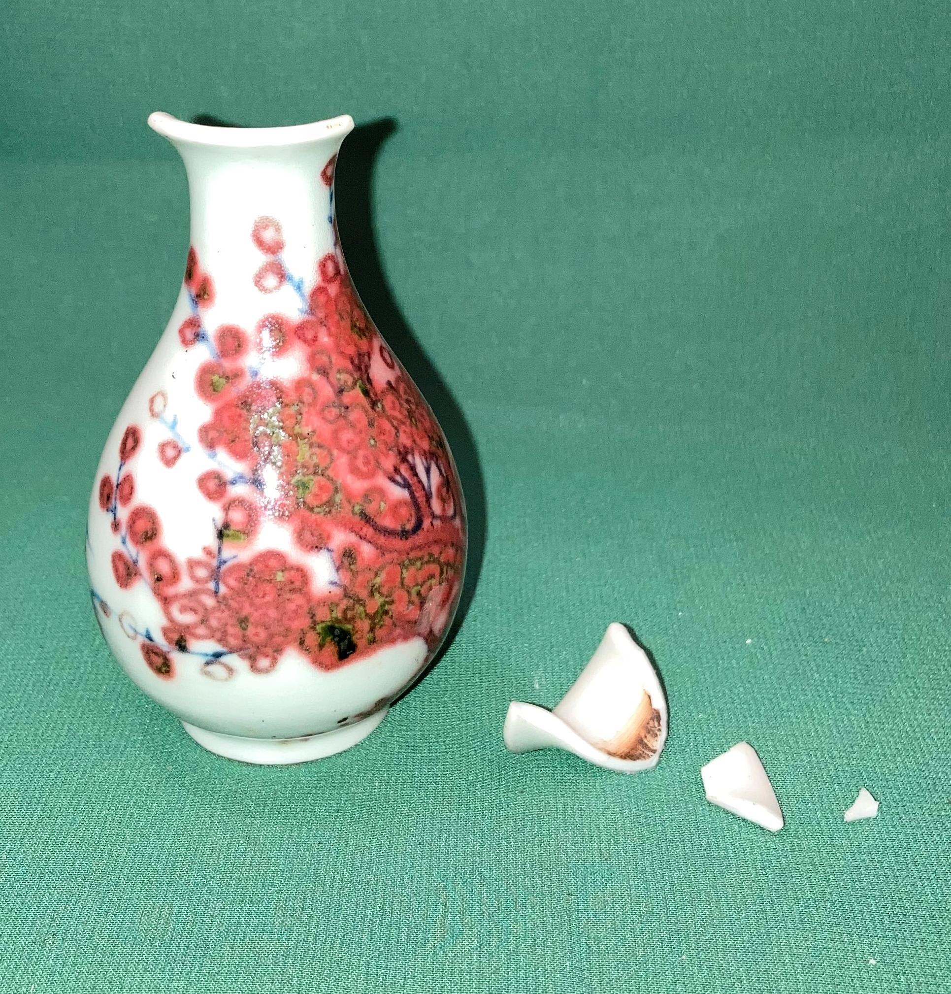 An early Oriental vase (damaged to top - all pieces here) with makers mark to base,