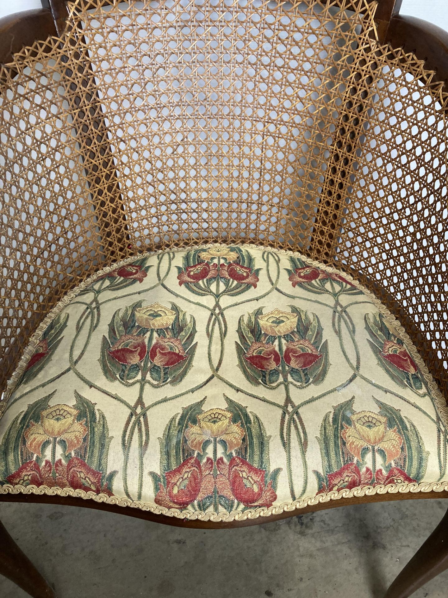 A vintage Bergère armchair with floral upholstered seat fabric (saleroom location: S2 QB13) - Image 2 of 5