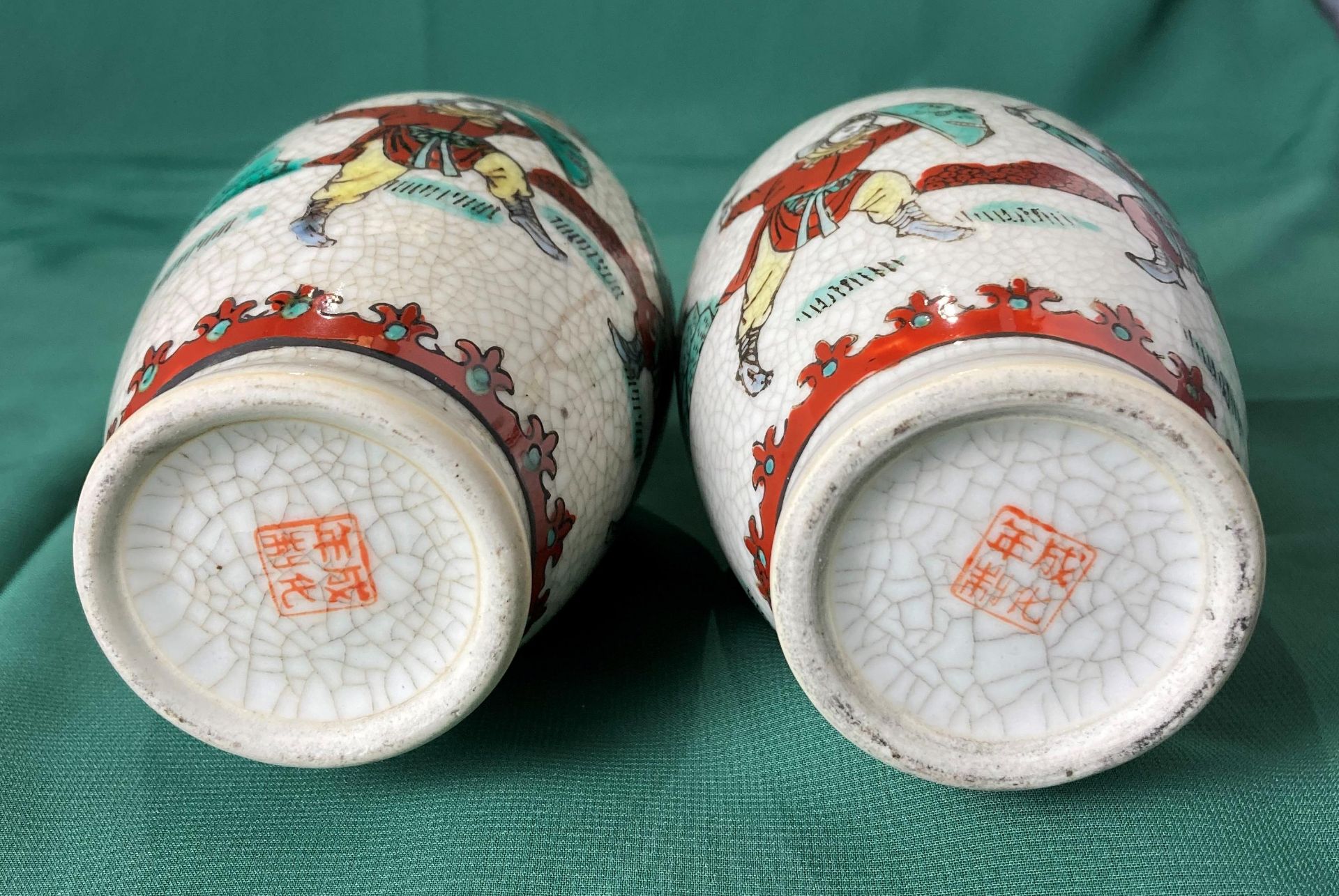 A pair of Oriental vases decorated with fighting warriors in a crackle glaze and stamp to base, - Image 4 of 6