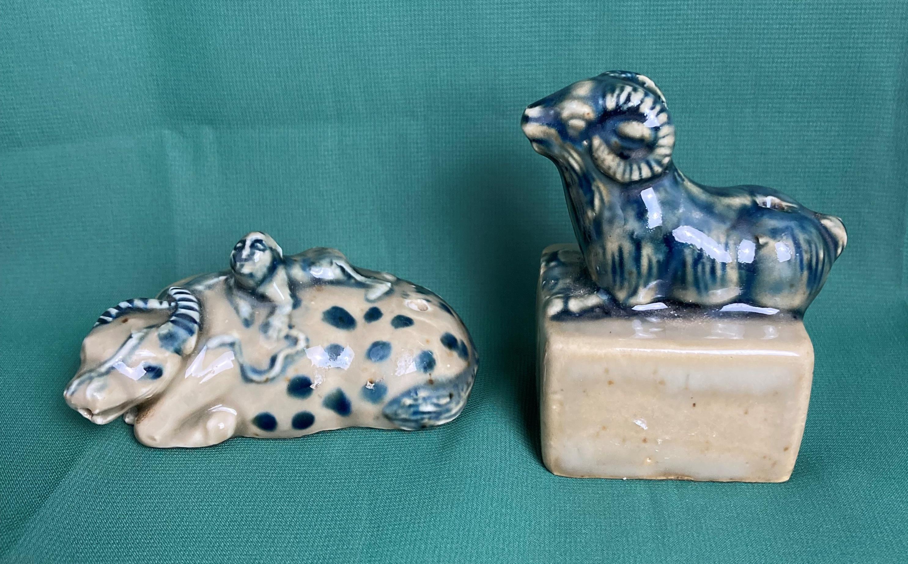 Two antique ceramic oriental 'Suiteki' water droppers including a ram on block with stamp to base