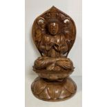 An Oriental wooden hand-carved meditating Buddha on lotus leaf - possibly Early 20th Century - 70cm