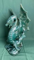 Green glazed ceramic dragon possibly for a lamp,