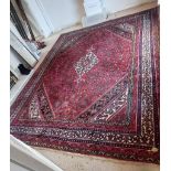 A red, green, blue and cream patterned oriental Hamadan rug,