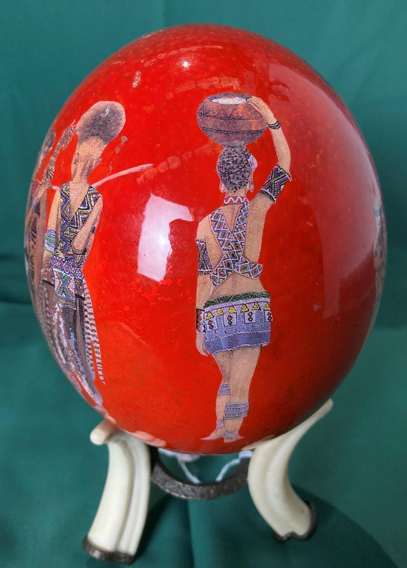 Hand-painted ostrich egg with African design on a reproduction tusk stand, - Image 3 of 5