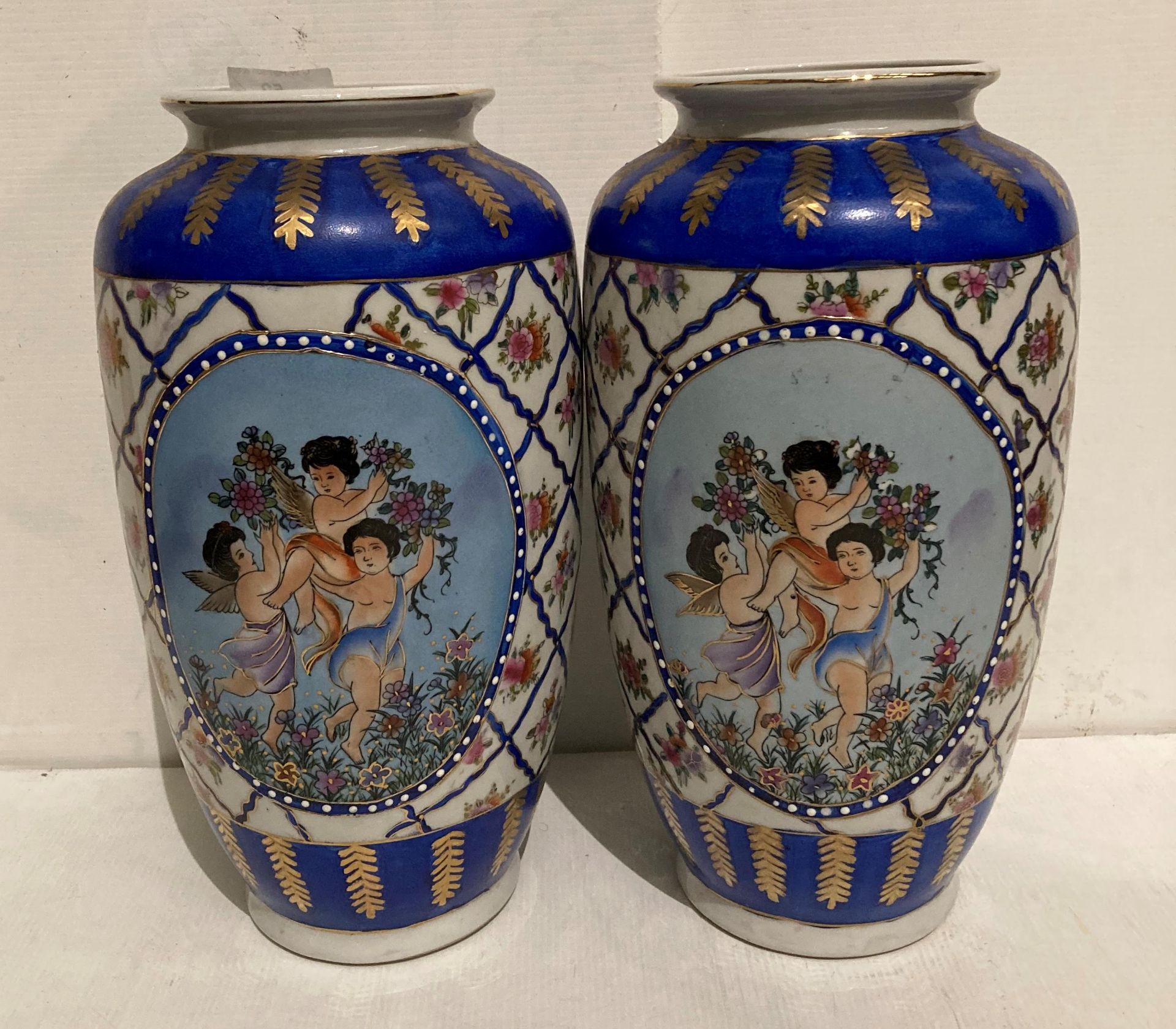 Pair of Oriental hand-painted vases (each 35cm high) painted with three winged cherubs (saleroom - Image 2 of 3