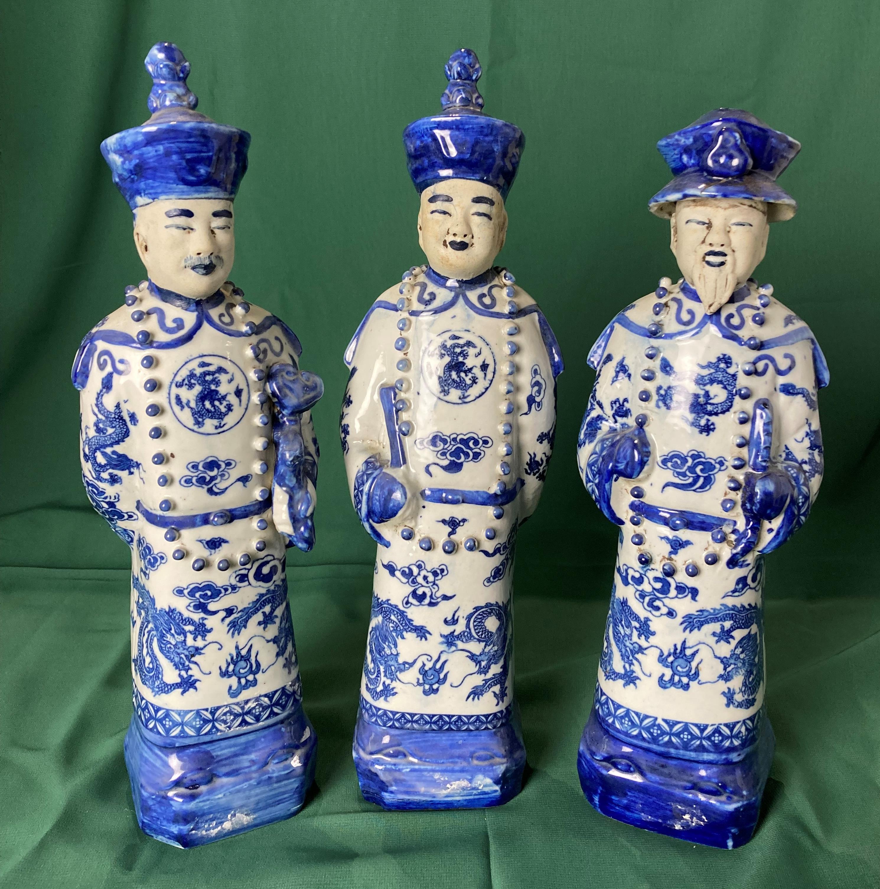 Set of three Chinese Emperors in blue and white ceramic with dragons (each 29cm high) with stamp to