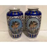 Pair of Oriental hand-painted vases (each 35cm high) painted with three winged cherubs (saleroom