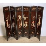A Mid-Century Oriental six-panel folding screen with soap stone display to each panel and etching
