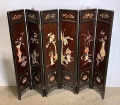 A Mid-Century Oriental six-panel folding screen with soap stone display to each panel and etching