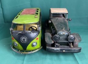 Two metal display vehicles including a VW Campervan,
