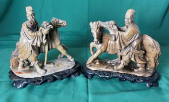 Two Oriental horse and man figures in marble/stone - possibly steatite - both hand carved and on