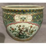 A Chinese jardiniere with carp, bird and peony panels,