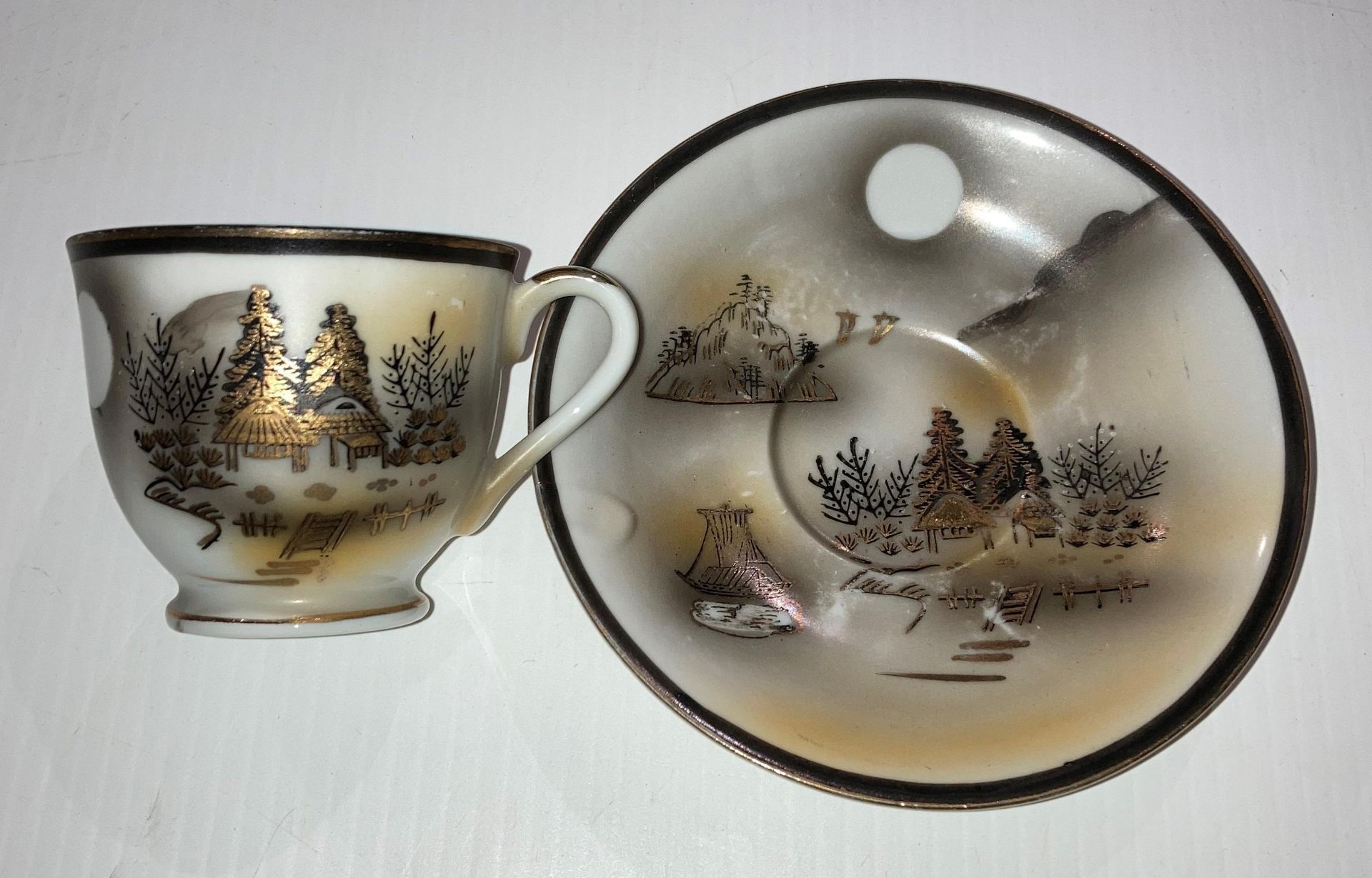 A vintage Japanese 13-piece Kutani Lithophang tea service - cups with Geisha face visible at the - Image 3 of 5