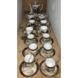 A vintage Japanese 13-piece Kutani Lithophang tea service - cups with Geisha face visible at the