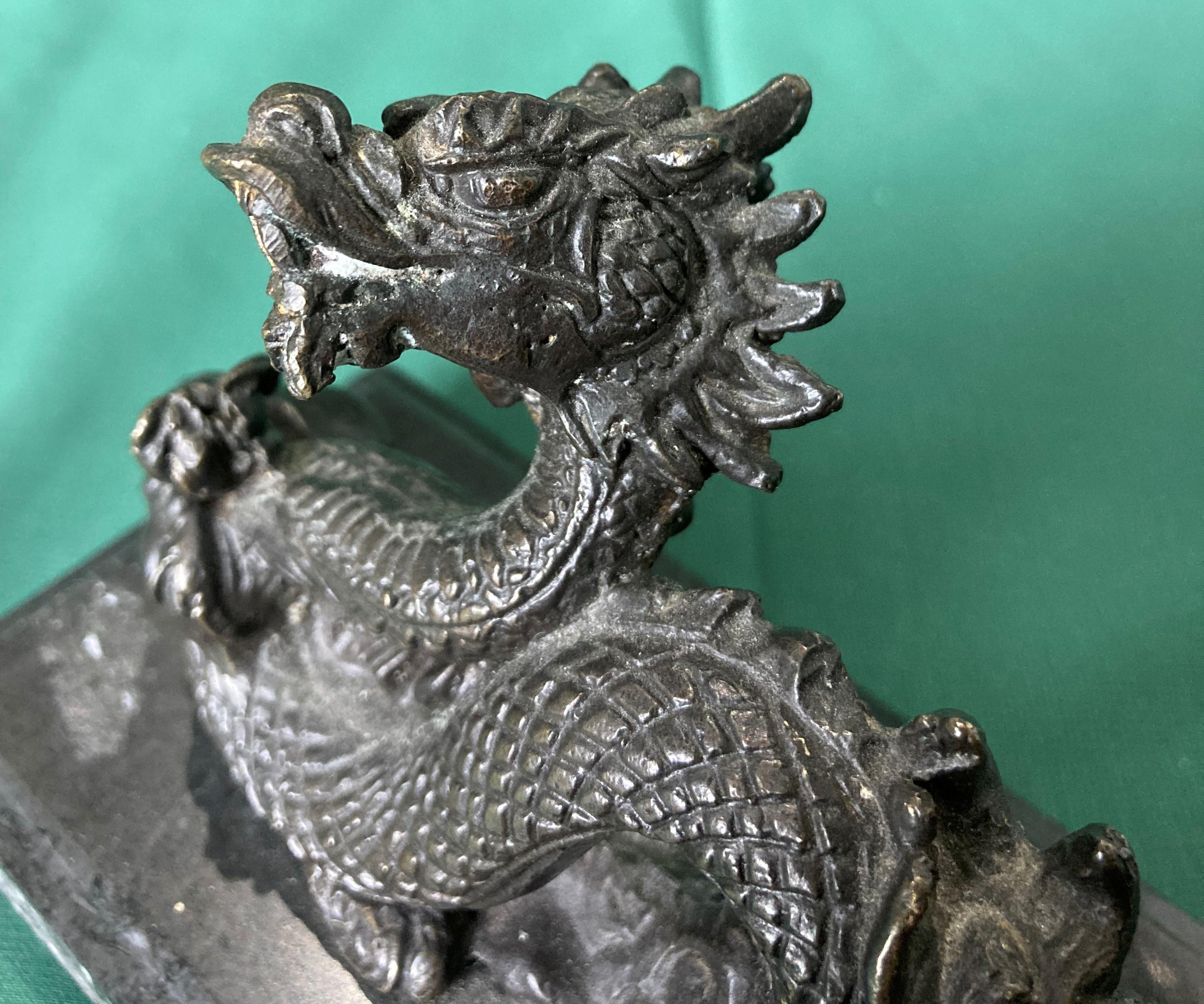 Bronze dragon sculpture on black marble base, 10cm high x 13. - Image 4 of 4