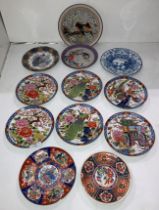 Set of six Oriental pattern picture plates (16cm diameter) with stamps to base and size assorted