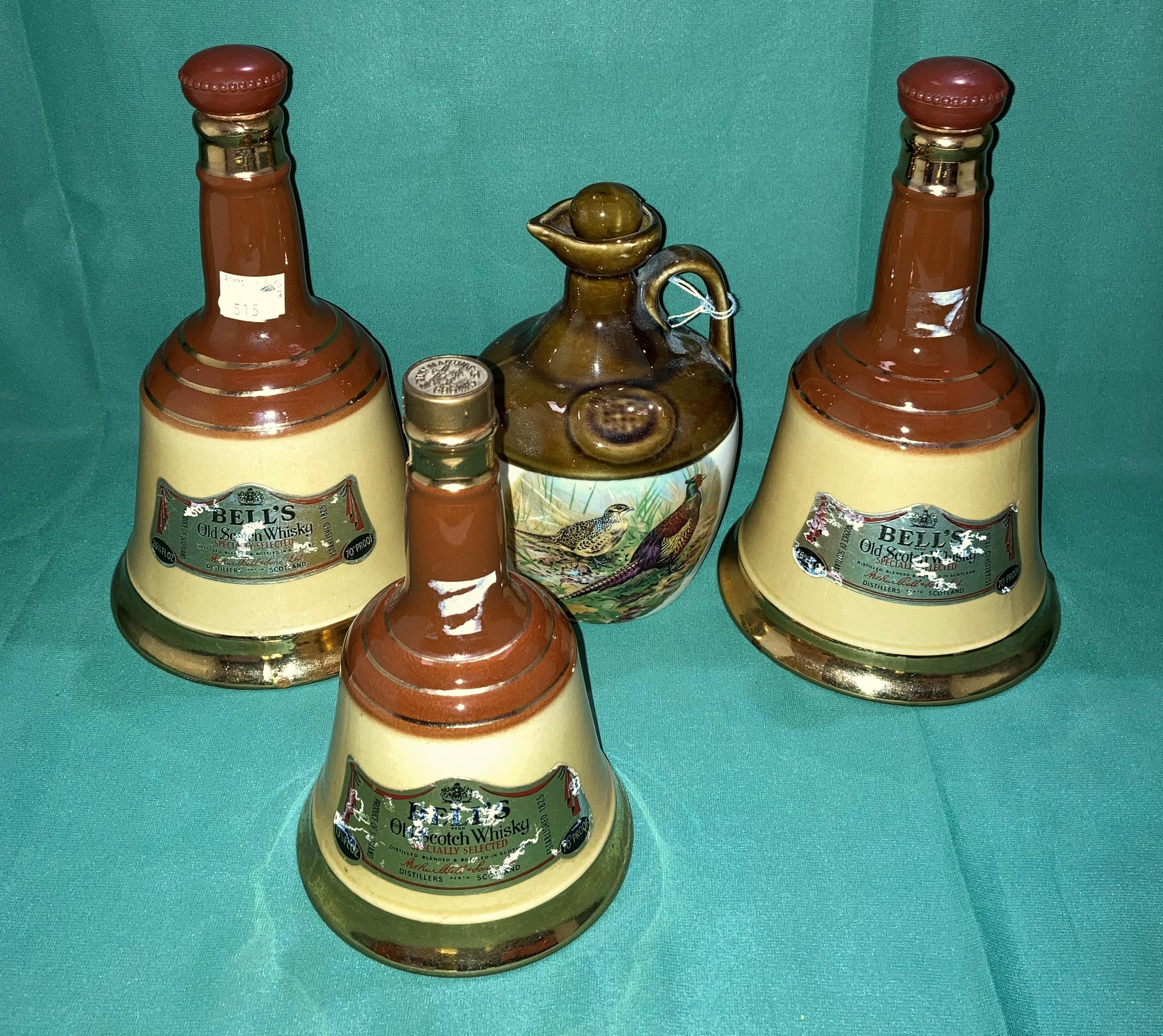 Pair of Bells ceramic wade 26 2/3floz bottles and 13 1/3floz bottles and a Montrose pheasant