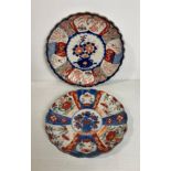 Two Oriental hand-painted Imari pattern scalloped plates, 21.5cm diameter and 24.