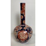 A porcelain Oriental hand-painted Imari pattern long neck bud vase (has repairs to top of neck),