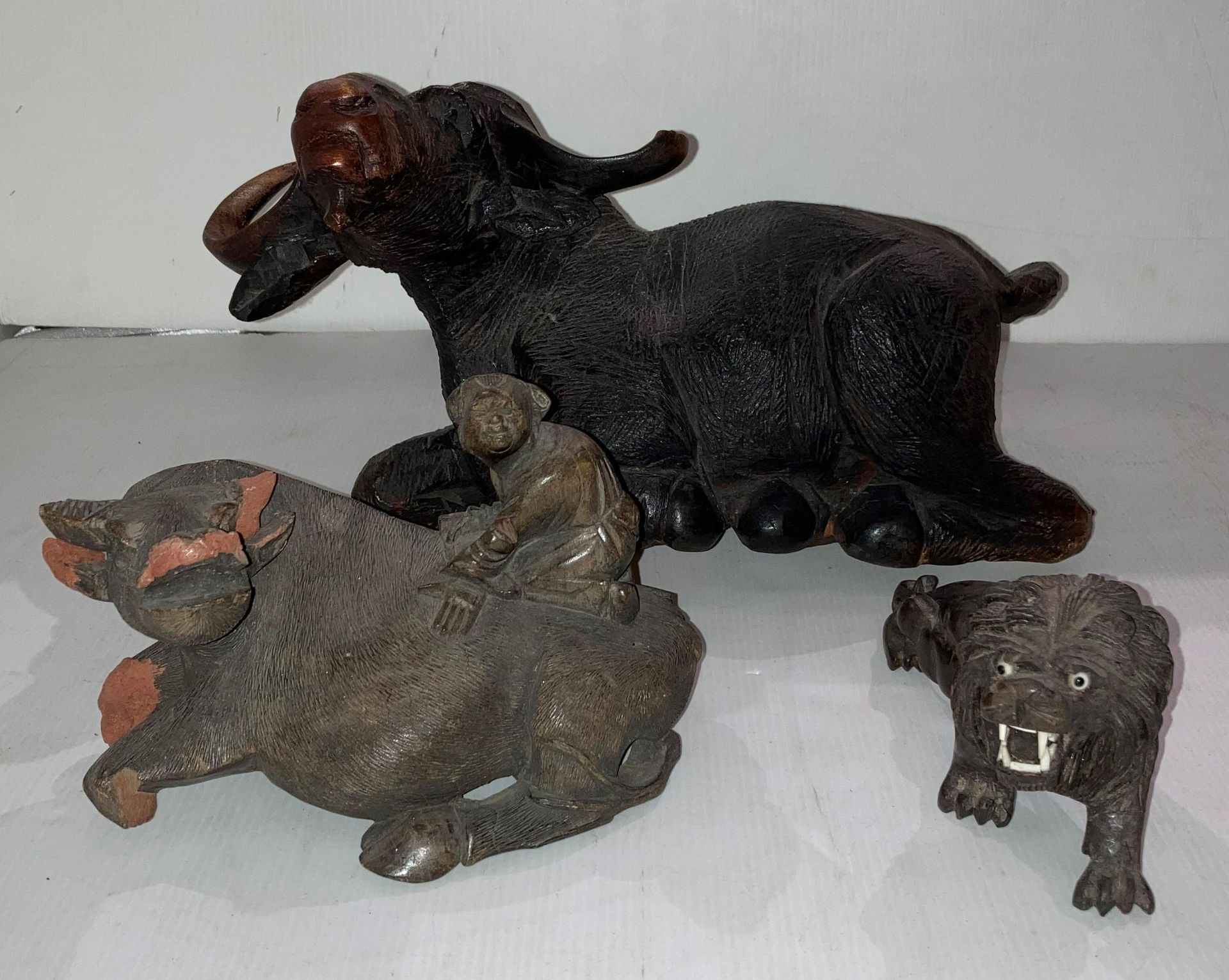 A large hand-carved wooden laid down water buffalo (damage to right horn) (39cm x 20cm high), - Image 2 of 3