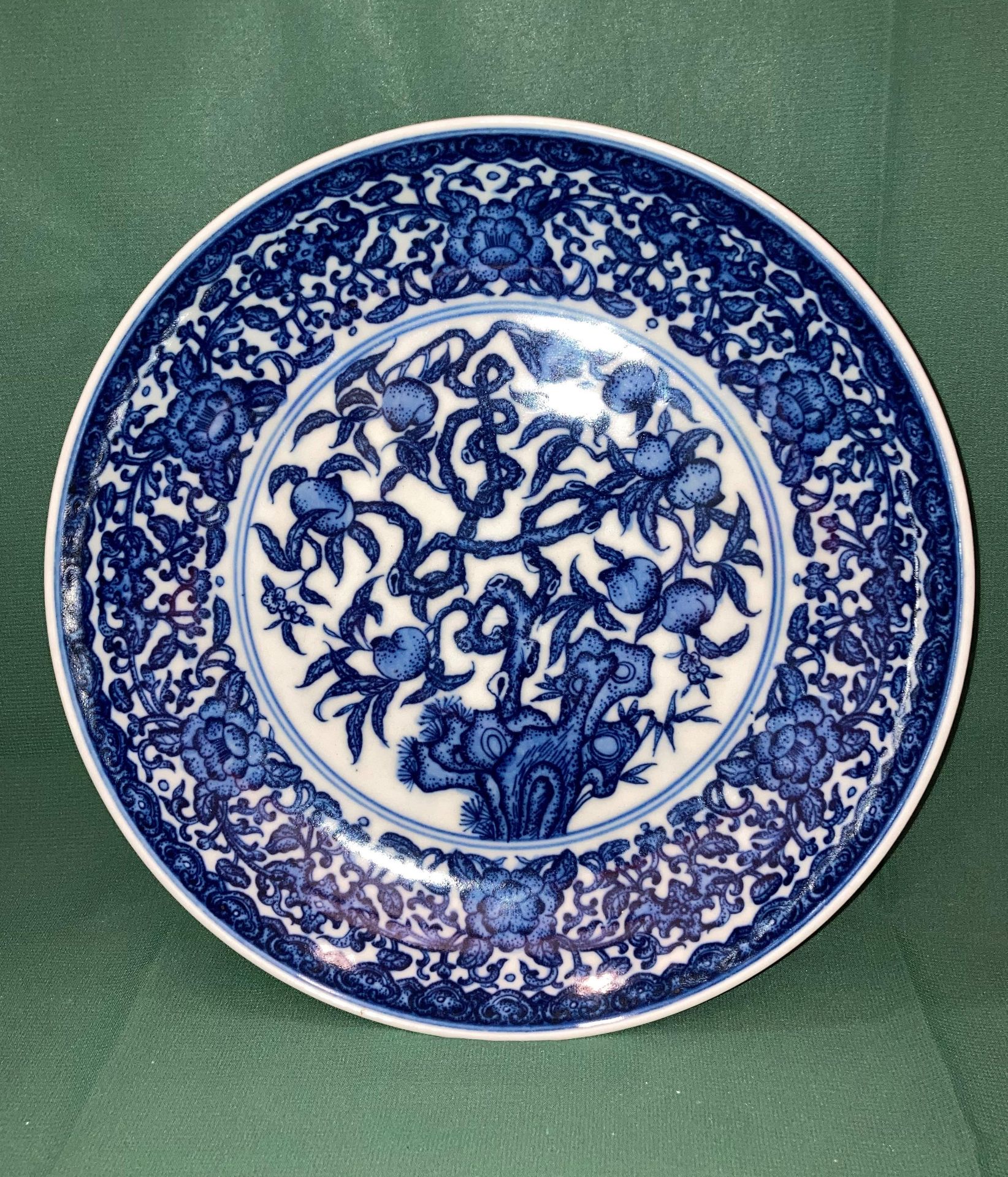 An antique 'Yongzheng' reign blue and white Oriental bowl with fig tree design and six symbol mark