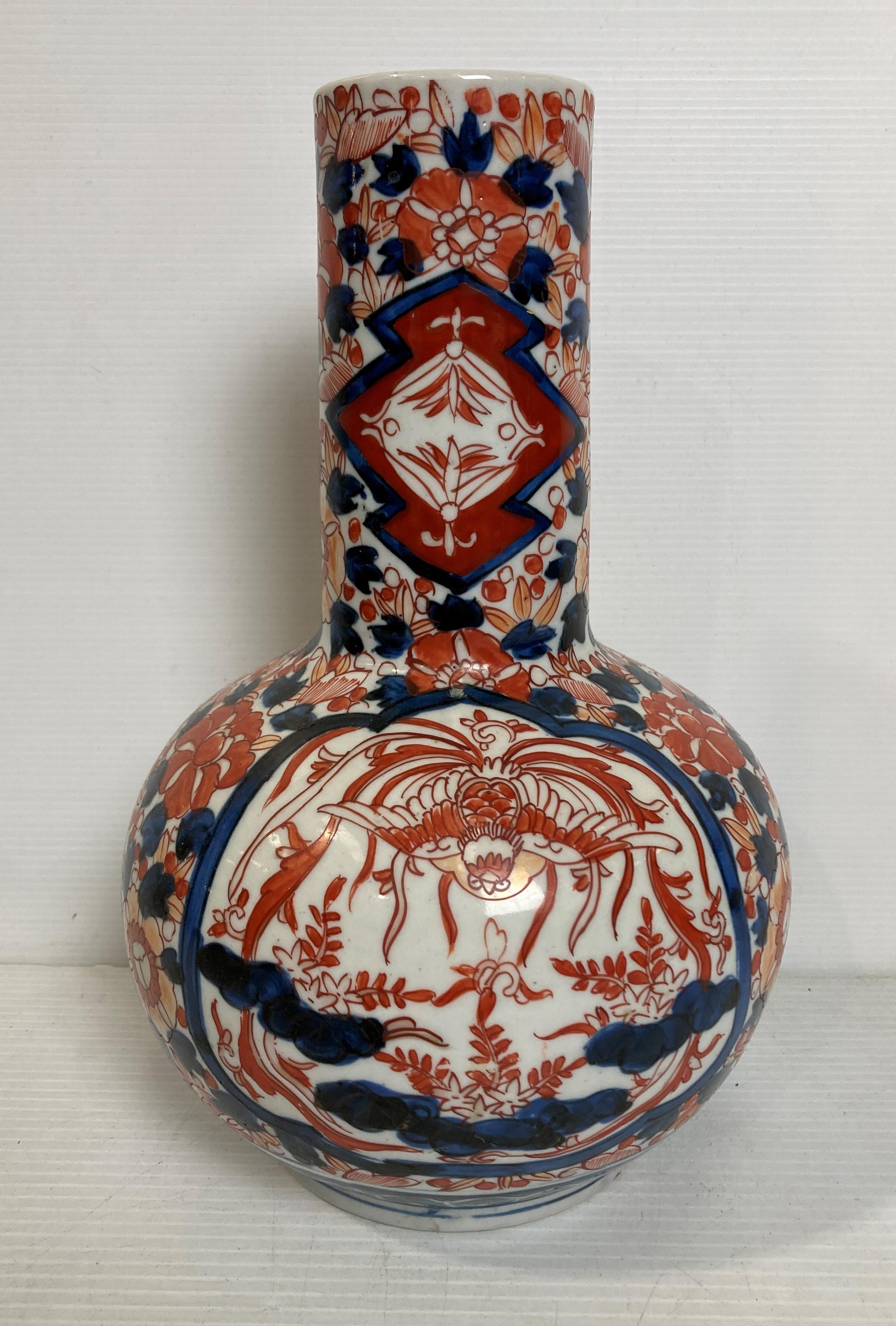 A porcelain hand-painted Oriental Imari pattern bottle vase,