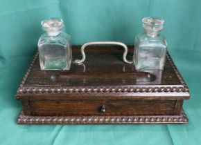 Mahogany double ink well stand with original glass bottles, both with stoppers and single drawer,