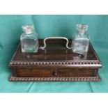 Mahogany double ink well stand with original glass bottles, both with stoppers and single drawer,