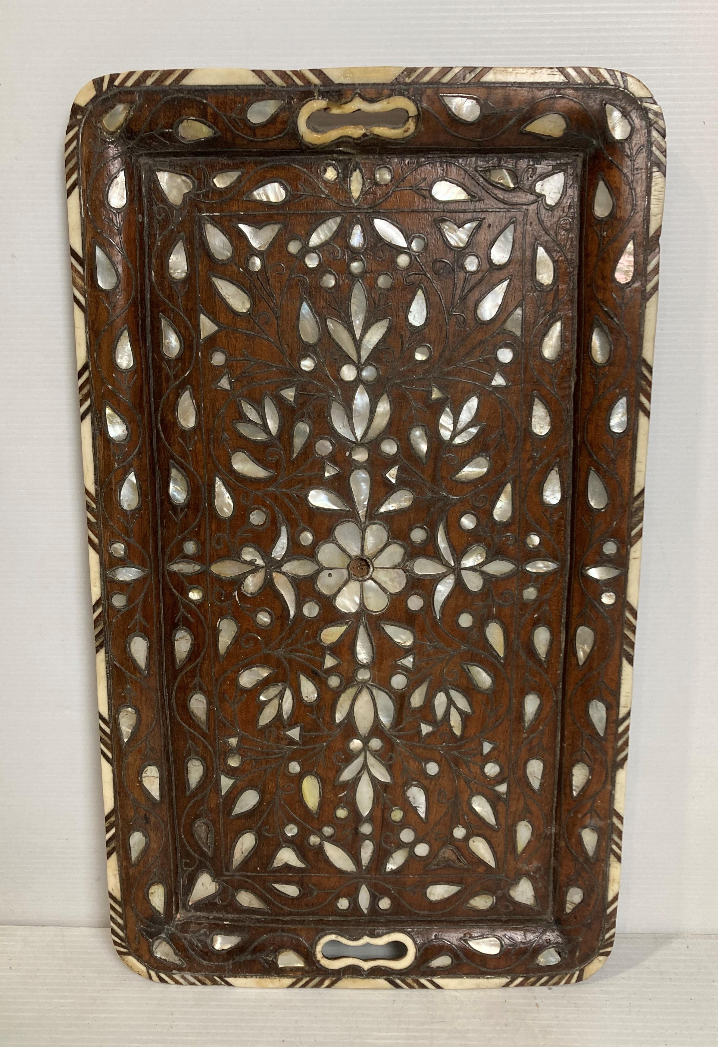 An Eastern wooden tray with mother of pearl inlay,