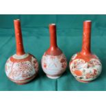 Three assorted Japanese Kutani small bud vases with long necks all decorated in floral design