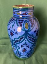 A clay glazed blue and black Persian vase (25cm high) with markers mark to base (saleroom location: