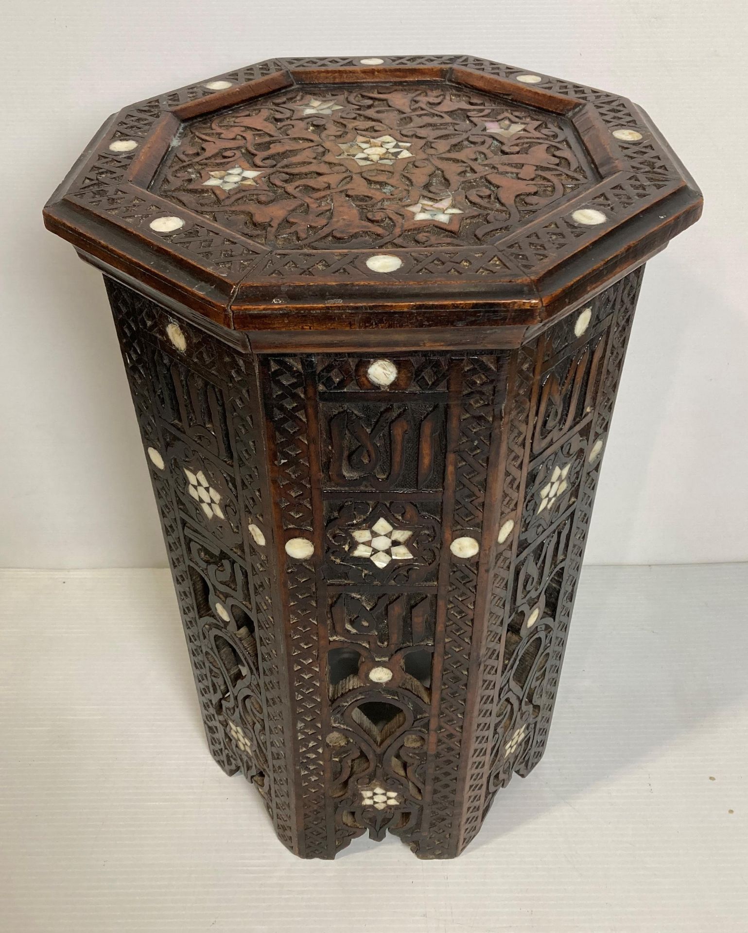 A hand-carved wooden Moorish eastern octagonal side table with mother of pearl inlay,