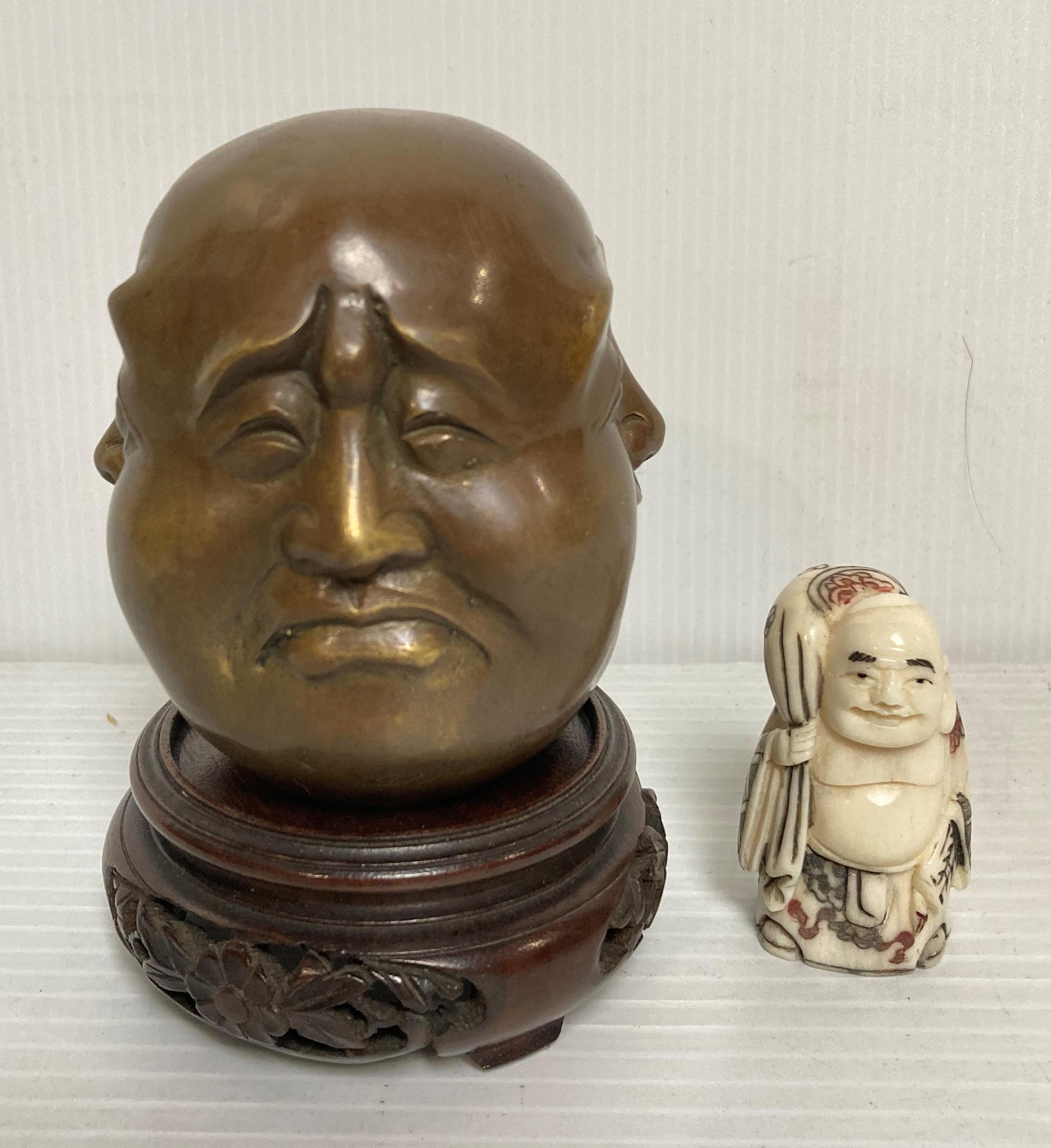 An antique Oriental bronze four-face Buddha with four symbol stamp to base on wooden hand-carved