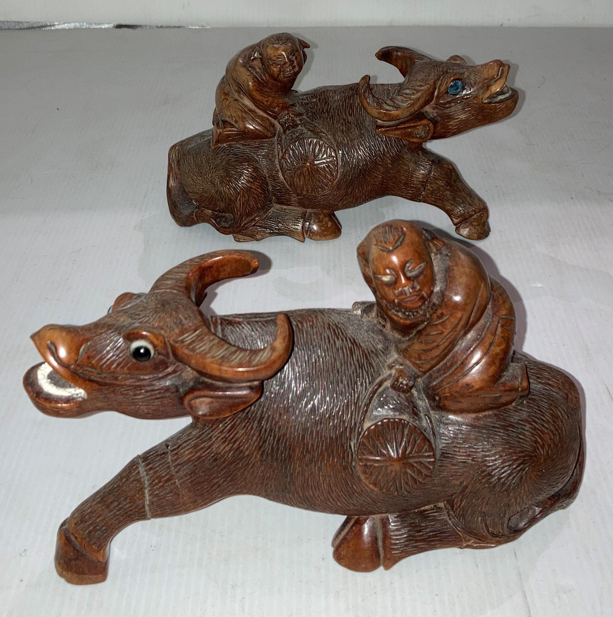 Pair of wooden hand-carved Oriental water buffalo with figures seated, approximately 10. - Image 3 of 4